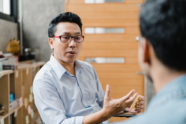 Man Talking to HR About a Dress Code Issue