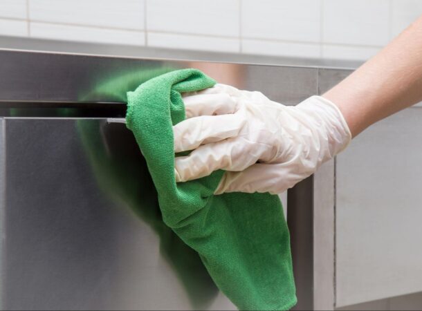 Food Chef Cleaning the Restaurant Kitchen With a Microfiber Towel by Prudential Overall Supply