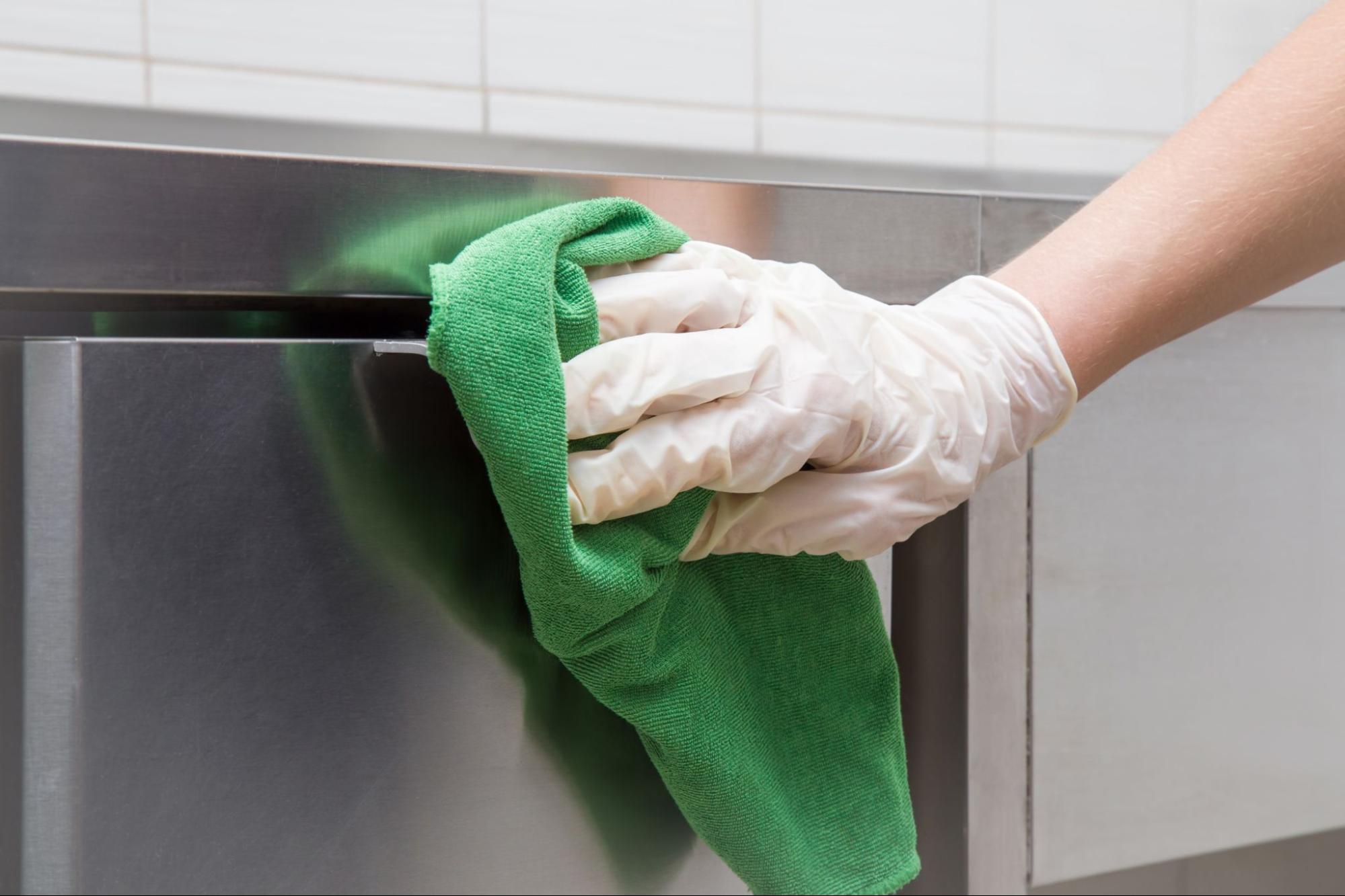 Food Chef Cleaning the Restaurant Kitchen With a Microfiber Towel by Prudential Overall Supply