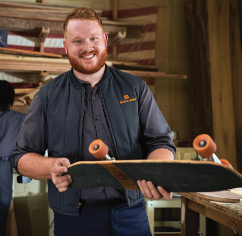 Man Wearing a Work Logo Vest by Prudential Overall Supply