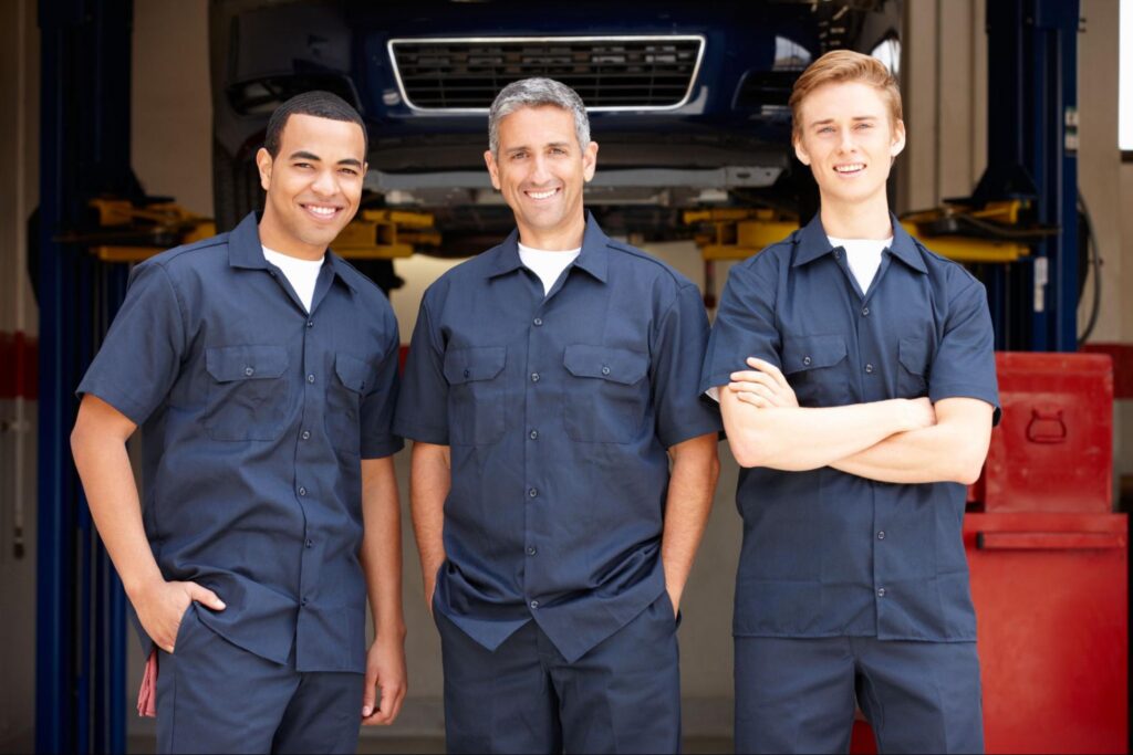 Car Mechanics Wearing Industrial Automotive Workwear