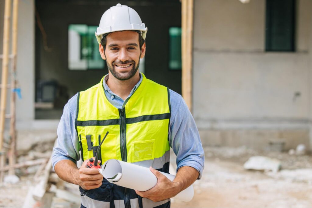 Construction Working Doing Demolition in a High Visibility Vest