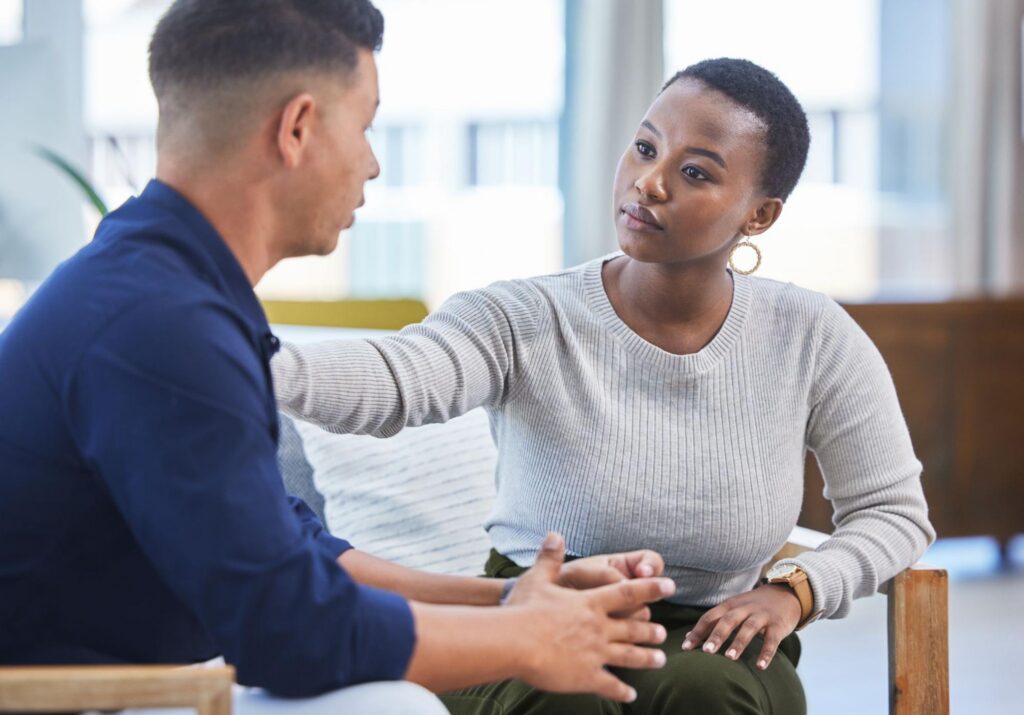 Man and Woman Talking at Work