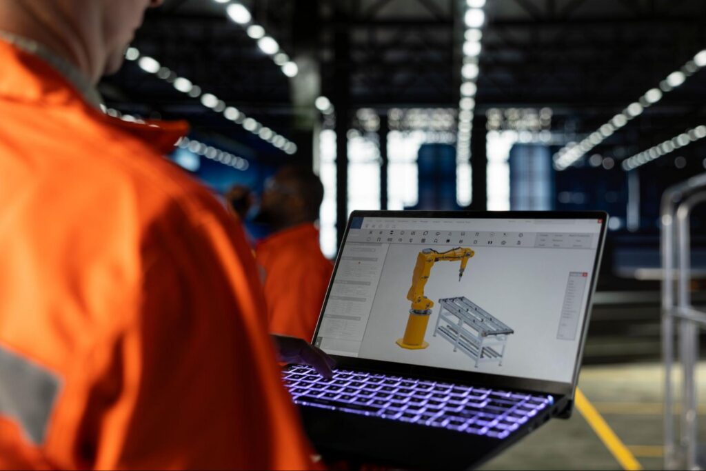 Engineer Reviewing AI on His Laptop