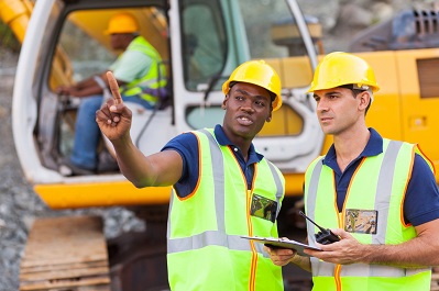 co-workers talking at construction