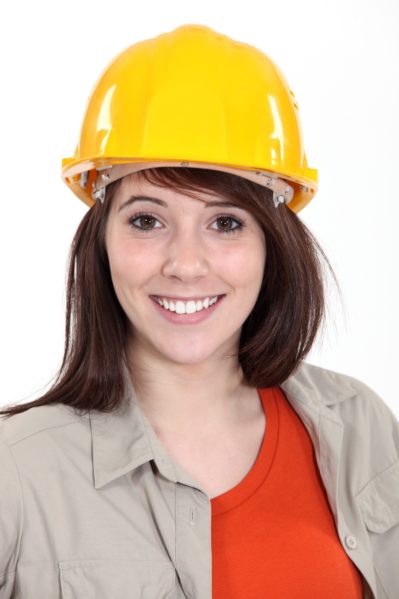 smiling woman wearing yellow hard hat