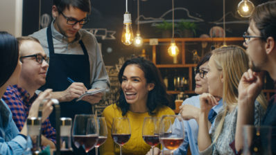 Waiter Takes Order From a Group of Friends