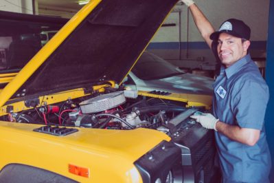 man holding open wide car trunk