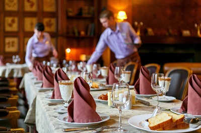 waiters prepare a table for breakfast