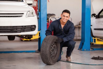 Happy mechanic loving his job