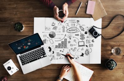 Businessman working on her business charts and graphs with laptop