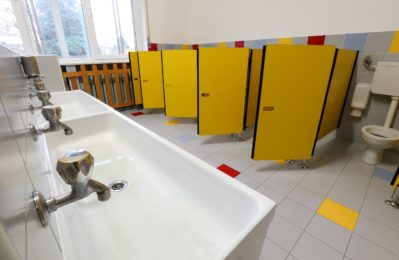taps of washbasin and yellow doors in the bathroom