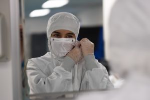 Women doctor wearing protective suit to fight coronavirus pandemic covid-2019.