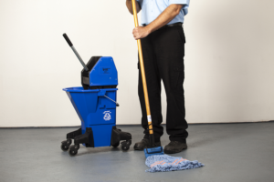 Male janitor mopping floor