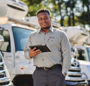 HVAC technicians wearing work uniform using digital tablet