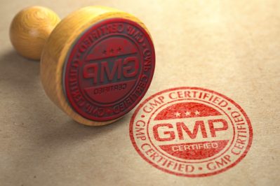 GMP Good Manufacturing Practice certified stamp on craft paper