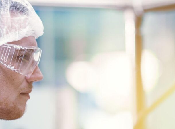 medicine factory scientist worker with Cannabis CBD oil extraction machine.