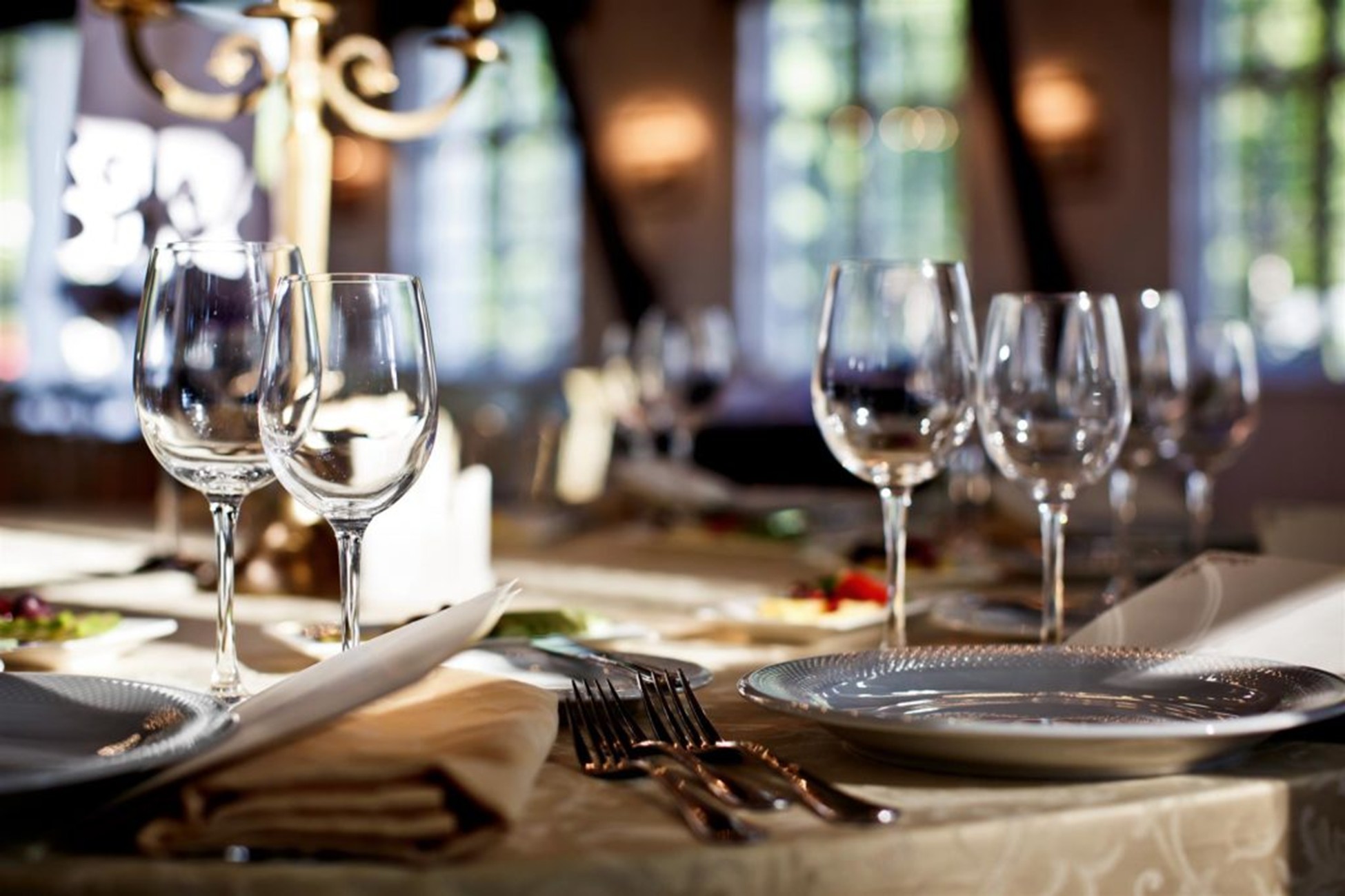 Napkins, Glasses and Silverware on a Restaurant Dining Table