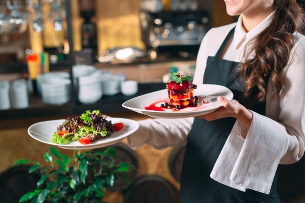 Woman Serving an Elegant Lunch