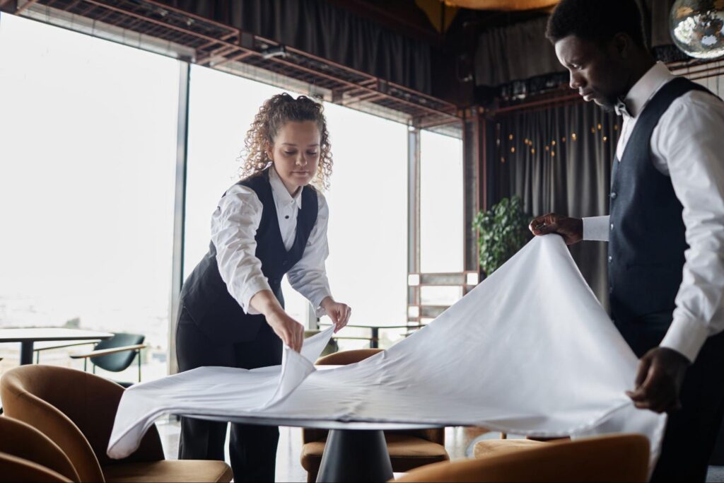 Waiting Staff at a Restaurant and Making the Table