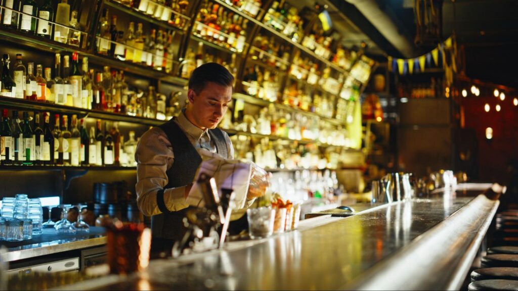 Bartender Serving Drinks Wearing a Nice Uniform