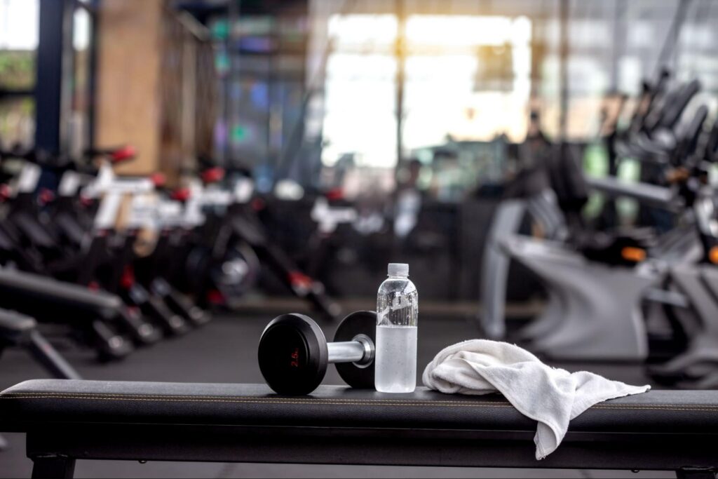 White Gym Towel Laying on Fitness Equipment