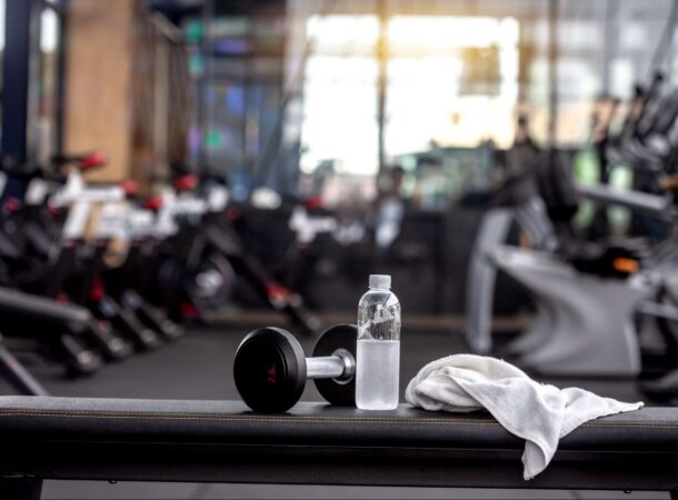 White Gym Towel Laying on Fitness Equipment