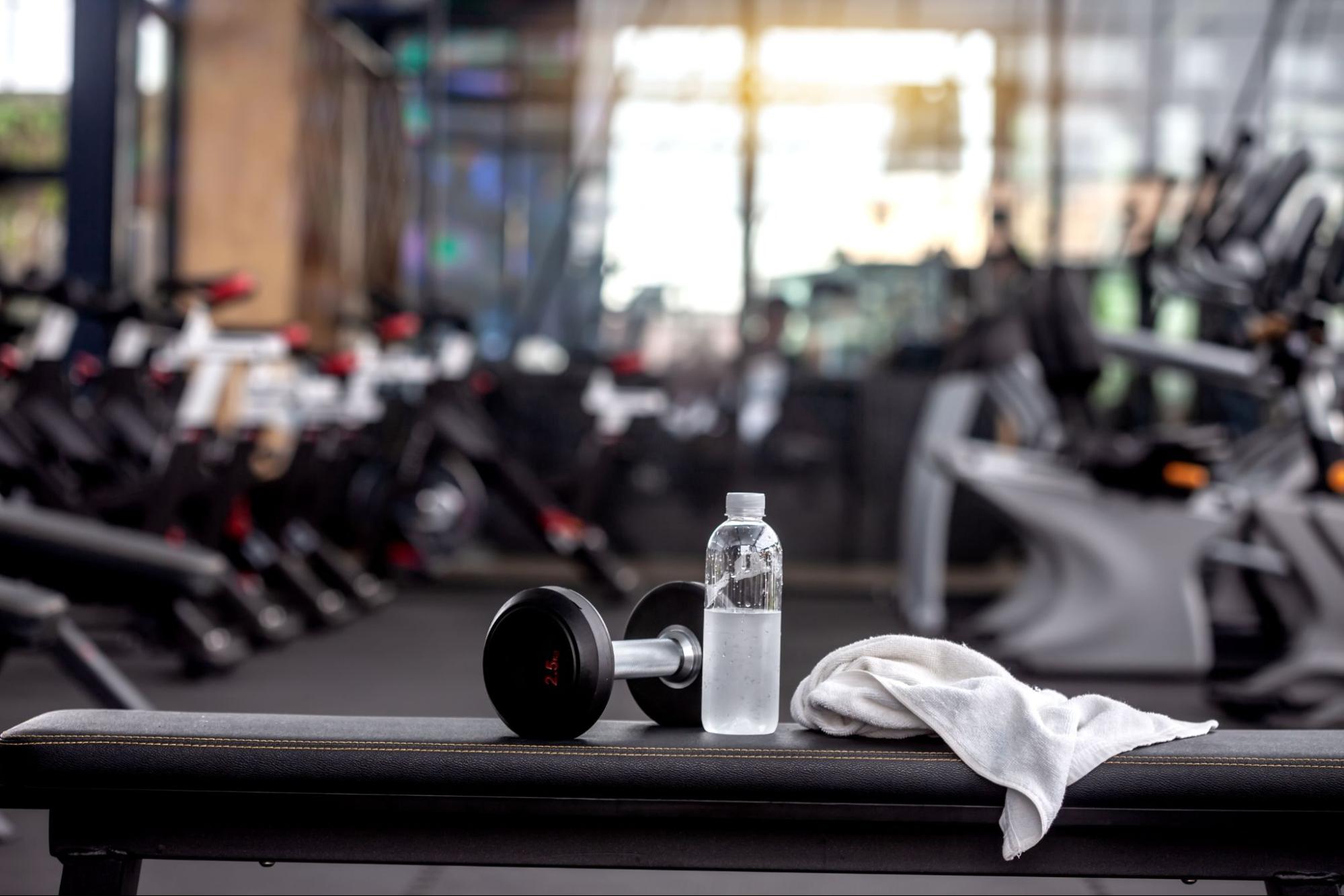 White Gym Towel Laying on Fitness Equipment
